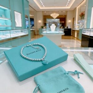 Tiffany & Co. Sterling Silver Bead Bracelet with Blue Heart Tag